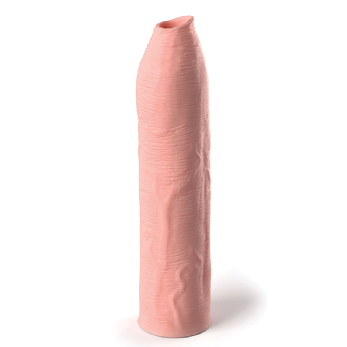 The image shows a vanilla-colored, cylindrical Fantasy Uncut 7 Inch Silicone Penis Extension by Pipedream Products with a textured outer surface, standing upright on a white background. The top of the extension is slightly rounded and appears to have a small opening.