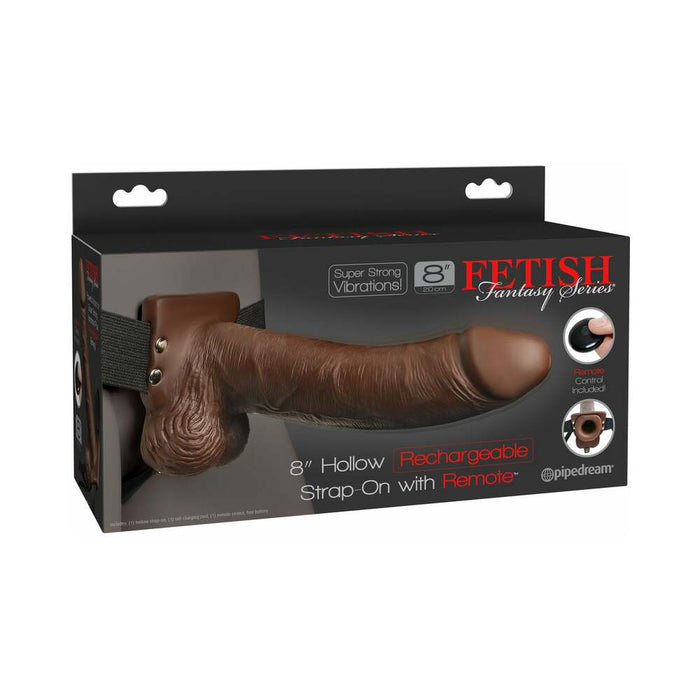 Box containing a Pipedream Products Fetish Fantasy Vibrating 8 Inch Hollow Dildo & Strap-on Harness with Remote in Chocolate. The box displays an image of the strap-on, showcasing its realistic design with an adjustable strap and remote control. Ideal for those experiencing erectile dysfunction, it offers strong vibrations and is rechargeable.