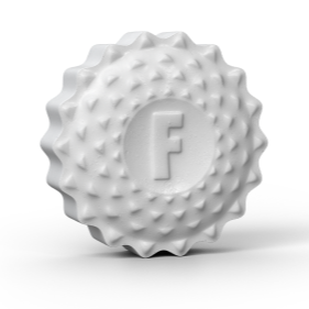 A Flintts Mints' white, round, textured mint from the "Flintts Mouth Watering Mints - Mint Flavor" collection features an embossed letter "F" in the center surrounded by a series of small, raised bumps arranged in a circular pattern that give it a sparkling effect.