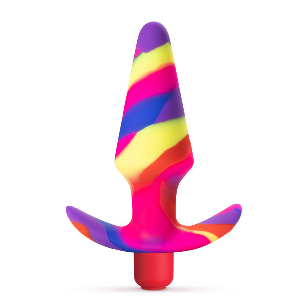 Introducing the Blush Free Spirit Vibrating 10 Function Beginner Silicone Butt Plug, featuring a brightly colored, striped design with shades of pink, purple, blue, yellow, and orange arranged in an irregular pattern. This beginner-friendly booty plug comes with a flared, flexible safety base and a narrow, tapered tip for comfortable use.