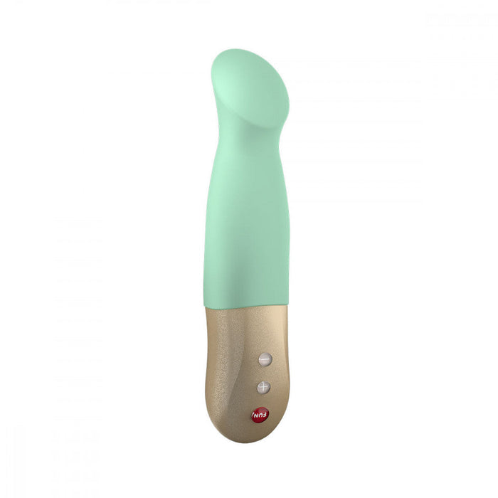 A pistachio-colored Fun Factory Sundaze Thrusting Vibrator with a gold-colored handle featuring two control buttons. The ergonomic design and smooth texture offer user-friendly operation, while its pulsing and stroking motions promise a tailored experience.