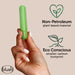 A hand holding a green cylindrical object against a beige background. Text on the right reads "Non-Petroleum plant-based material" with a heart-shaped leaf icon and "Eco Conscious smaller carbon footprint" with a plant sprout icon. The "Blush" logo is in the bottom left, highlighting their Gaia Biodegradable, Recyclable Eco Bullet Vibrator - Green.