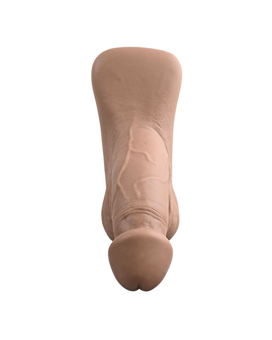 Image of a realistic flesh-colored dildo, showcasing details and texture. The Gender X 4 Inch Ultra Realistic Silicone Packer with Wide Base - Caramel by Evolved Novelties is positioned upright on a white background.