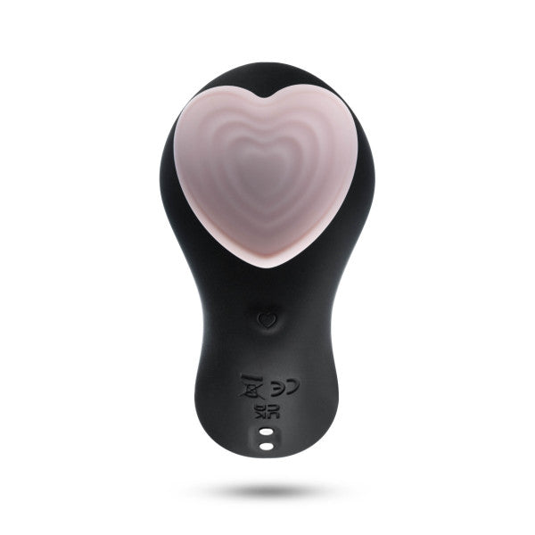 The Heartbeat Panty Vibrator with Remote Control by Blush is a black handheld device featuring a large pink heart-shaped button on top. The front of this wireless remote control displays icons for various buttons and settings. Made from hypoallergenic silicone, its sleek and ergonomic design ensures both comfort and safety.