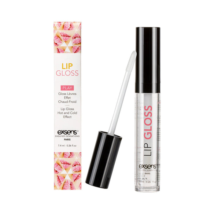 Image of Exsens Hot Kiss Arousal Lip Gloss - Strawberry Flavored with a warming sensation. The product includes a box and an open tube of lip gloss with a wand applicator. The box features the product name, description, and decorative elements, while the clear tube showcases the body-safe gloss.