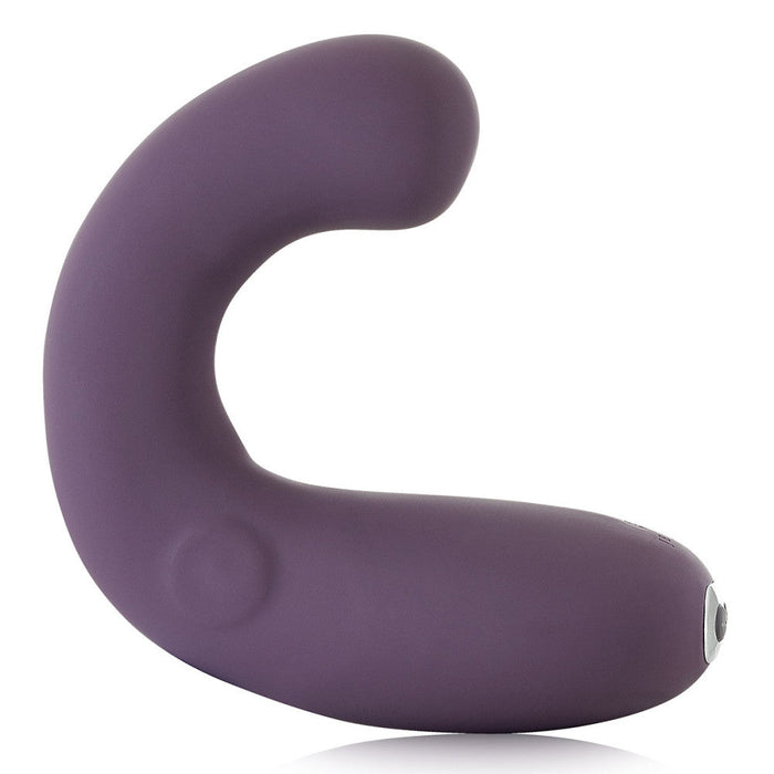 The Je Joue G-Kii Flexible Clitoral & G-Spot Vibrator by Je Joue is a purple, C-shaped personal massager featuring a seamless silicone body and smooth surface. Designed for intimate use, it includes a small control button at one end and offers an adjustable G-spot vibrator setting. This USB rechargeable device ensures versatile pleasure.