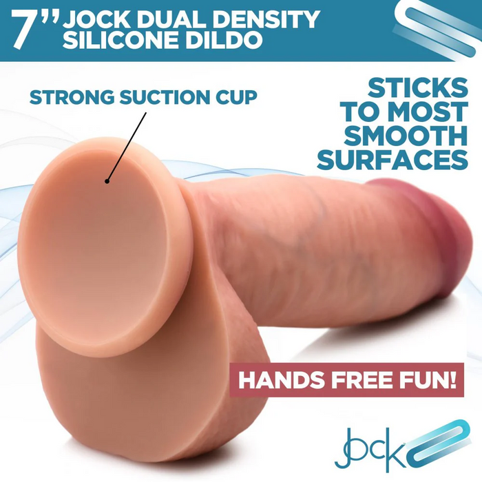 A promotional image for the Jock Dual Density Silicone 7 Inch Dildo with Balls & Suction Cup - Vanilla by XR Brands. The image showcases the realistic dildo with text highlighting its strong, waterproof suction cup, allowing it to adhere to most smooth surfaces for hands-free fun.