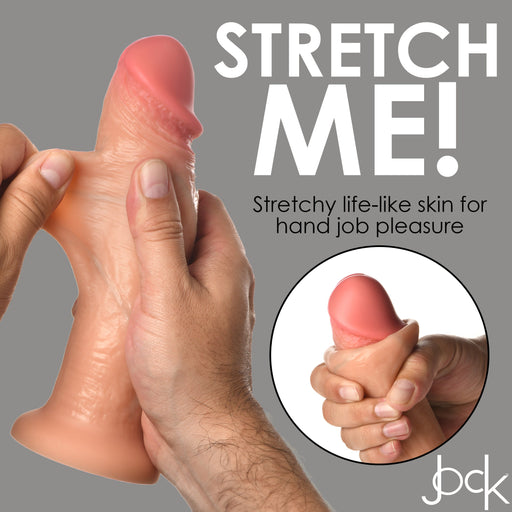 A hand grasps the Jock Real Skin 8 Inch Silicone Suction Cup Dildo in Vanilla by XR Brands, showcasing its realistic, stretchable design. Text reads, "STRETCH ME! Stretchy life-like skin for hand job pleasure." A circular inset shows a close-up of the dildo being stretched. The XR Brands logo appears at the bottom.