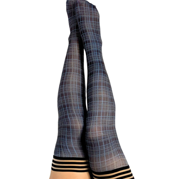 A pair of legs are raised against a white background, adorned in Kix'ies Debbie Navy Blue Plaid Thigh Highs (sizes A-D) featuring black horizontal stripes at the top. These stockings, available in Petite to Plus Size, offer a sophisticated look with the added security of a no-slip-grip.