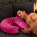 Asian man sleeping against Liberator Arie Toy Mount Spooning Pillow - Pink