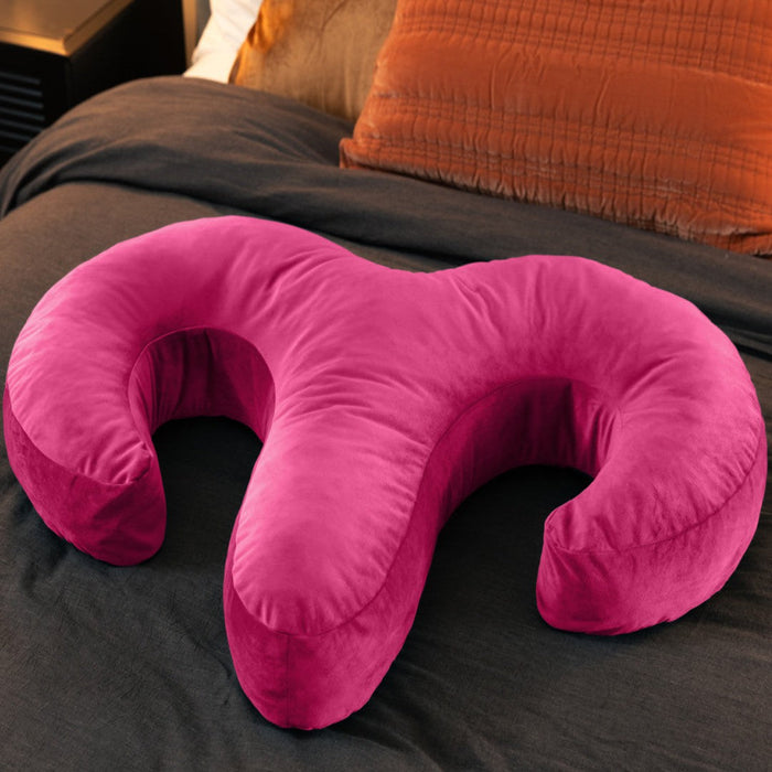 Liberator Arie Toy Mount Spooning Pillow - Pink on bed with brown comforter 