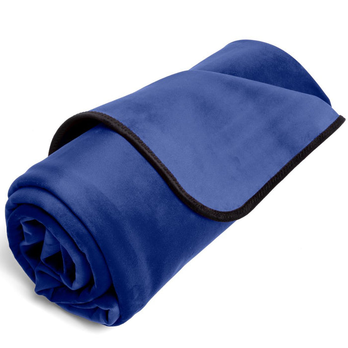 A neatly rolled-up royal blue Liberator Fascinator Throw Mini Sized Velvety Sex Blanket with dark edging, isolated on a white background.