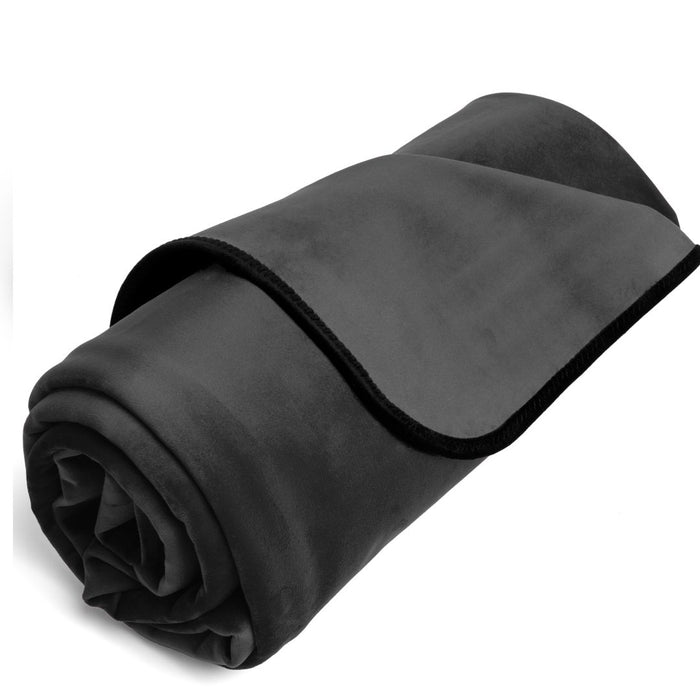 A rolled-up black Liberator Fascinator Throw Mini Sized Velvety Sex Blanket isolated on a white background.