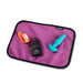 Liberator Fascinator Toy Pad Mini Waterproof Sex Blanket - Pink  with toys and lube on it 