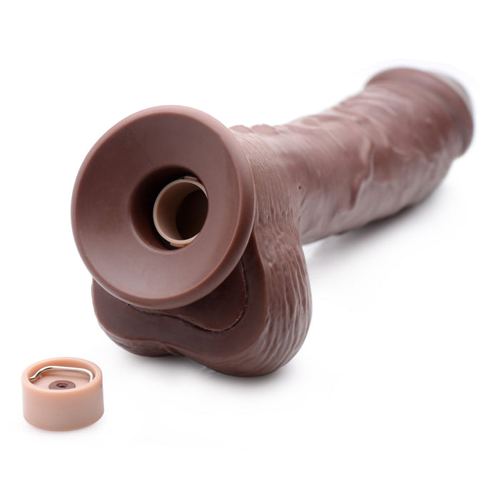 Introducing the Loadz 8.5 Inch Vibrating Squirting Dildo with Wireless Remote Control - Chocolate by XR Brands. Crafted in a rich brown hue, this cylindrical adult toy features a phallic shape with textured details and offers 10 modes of vibration. The removable end cap is shown alongside the toy, revealing its battery compartment, all displayed on a plain white background.