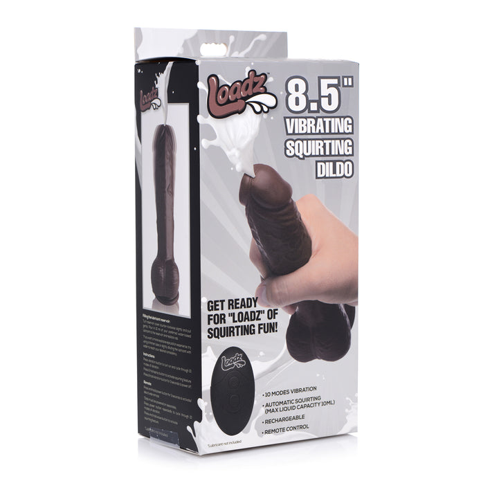 Packaging for the XR Brands Loadz 8.5 Inch Vibrating Squirting Dildo with Wireless Remote Control - Chocolate. The box features an image of the realistic vibrating squirting dildo and highlights features such as 10 modes of vibration, automatic squirting with a 100mL capacity, rechargeable battery, and wireless remote control.