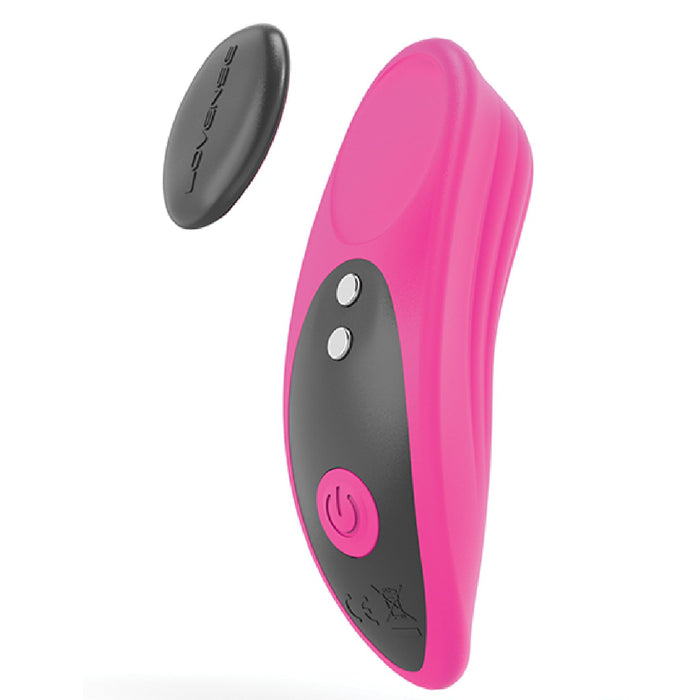 The Lovense Ferri Bluetooth App Controlled Panty Vibrator by Lovense is a pink and black wearable device with a sleek, ergonomic design featuring two buttons and a power symbol. An oval-shaped black remote control is displayed next to it. Compatible with the Lovense app for enhanced functionality, this device also includes a discreet magnetic clip for secure placement.