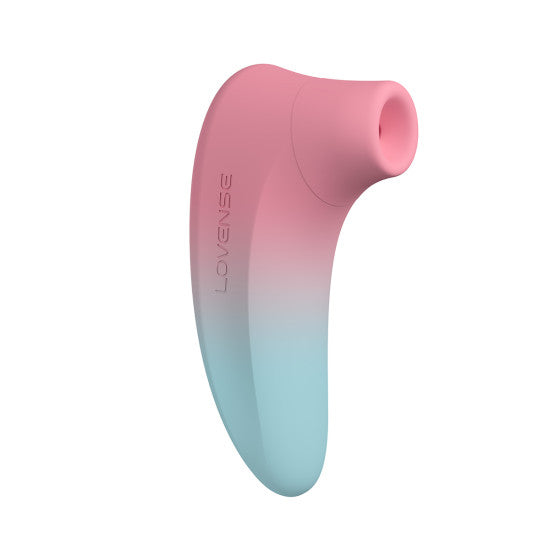 A sleek, curved personal massager in a pink and teal gradient with a soft, narrow nozzle at the top. The word "Lovense" is printed along the side of the Lovense Tenera 2 Bluetooth Clitoral Air Stimulator, which pairs seamlessly with the Lovense Remote App for enhanced clitoral stimulation.