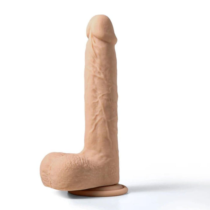 A Luis Thrusting Warming Large 8.5" Realistic App Controlled Dildo by Honey Play Box, with detailed textures, standing upright on a white background.