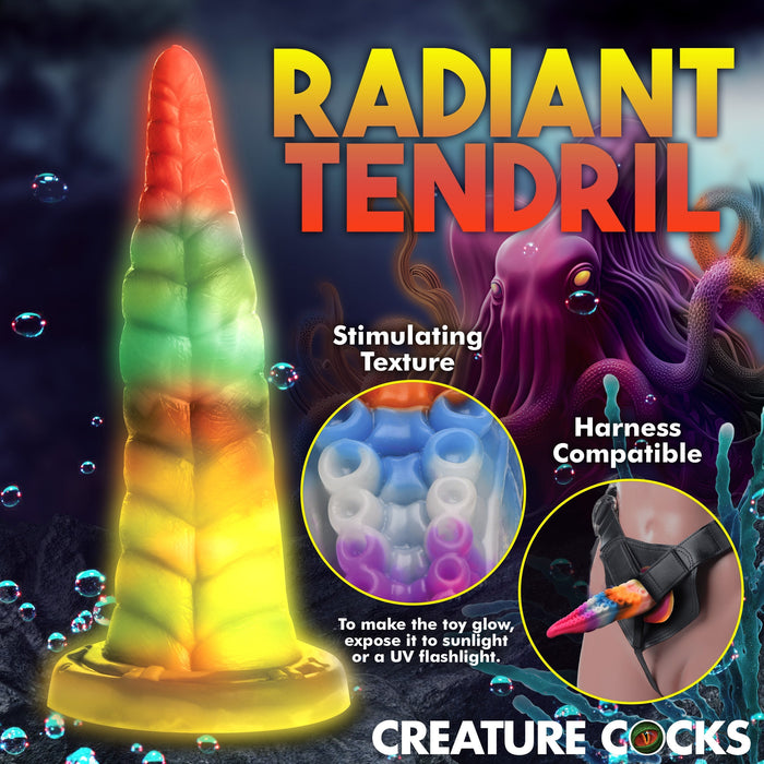 An image showcasing the "Luminoctopus Glow-in-the-Dark Tentacle Dildo" from XR Brands. The toy is colorful with a spiral design, made from premium silicone, offering a stimulating texture and being harness compatible. An inset highlights the glow effect, activated by sunlight or a UV flashlight.