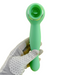 A gloved hand holds the Nasstoys Luscious Licker Double Ended Licking & G-Spot Vibrator in mint green, featuring a circular head and a sleek, ergonomic handle. The white glove with black polka dots contrasts against the plain white background, emphasizing the device's silky silicone finish.