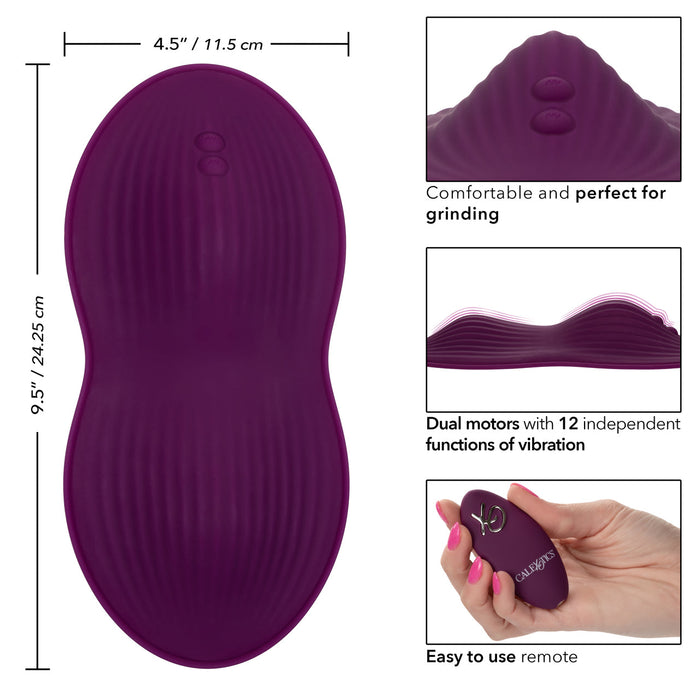 The Lust Dual Rider Remote Control Humping Vibrator by CalExotics is a purple, oval-shaped massager with a textured surface, measuring 4.5 inches by 9.5 inches. It features dual motors and offers 12 independent vibration functions along with waterproof capabilities. The device comes with an easy-to-use wireless remote control and is praised for its comfort and grinding performance.