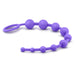 The Luxe Beginner Ultra Slim Silicone Anal Beads by Blush are crafted from body-safe purple silicone and feature a series of beads that gradually decrease in size, culminating with the largest bead attached to a convenient looped handle.