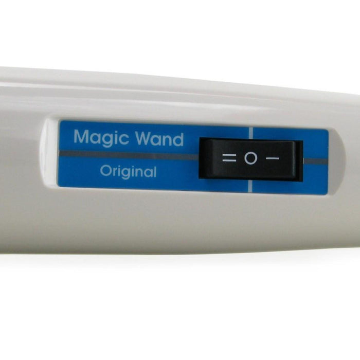 Close-up of a white personal massager with a blue label reading "Magic Wand The Original Ultra Powerful Wand Vibrator" by Vibratex. A black switch on the label can be set to three positions, indicated by markings for off, low, and high. This device is renowned for its deep vibrations.