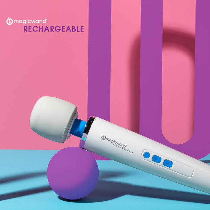 A cordless and rechargeable Magic Wand Unplugged personal massager from Vibratex, featuring a white handle and blue buttons, is angled against a pastel pink and blue background. The product name "magicwand UNPLUGGED RECHARGEABLE" is written in the top left corner, highlighting its premium silicone material.