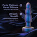 A Matrix Vibrating Gyrating Rimming Butt Plug with Remote in blue by Blush stands against a dark, silky background. Text on the image highlights its Puria Platinum-Cured Silicone material as nonporous and body-safe, and mentions its Ultrasilk Smooth texture for comfortable insertion and easy cleaning.