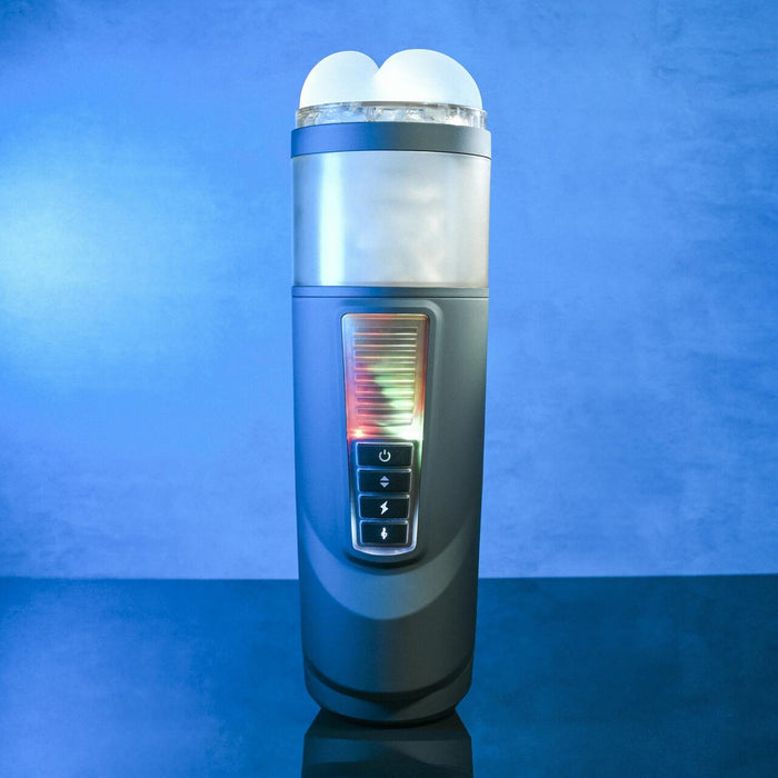 The Message in a Bottle Thrusting Spinning Stroker with Voices & Mount by Evolved Novelties is an electronic device with a cylindrical shape, featuring a digital screen and several buttons on the front. The top part has two round, smooth bulbs. This innovative stroker offers 7 speeds and functions. The background showcases a gradient of blue tones.