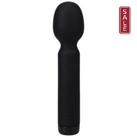 The Mini Silicone Wand Vibrator In a Bag by Doc Johnson is a sleek, black, cylindrical handheld device made from luxurious black velvet touch silicone. It features a rounded top and a slightly thicker area near the top. This USB rechargeable and waterproof personal care device stands out beautifully against a white background.