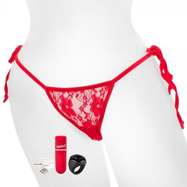 A mannequin proudly displays a pair of Screaming O's "My Secret Remote Control One Size Vibrating Panties" in a lacy design with adjustable side tie strings. Positioned in front of the mannequin are three items: a compact red remote control, a black ring-shaped vibrator, and a white USB charging cable.