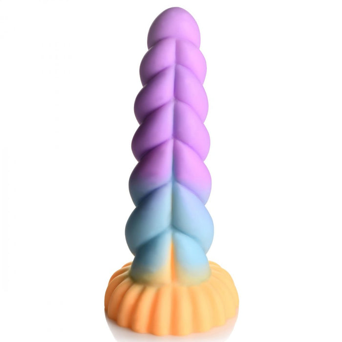 The Mystique Thick 8 Inch Silicone Unicorn Dildo by XR Brands features a multicolored, twisted spiral shape and a round, scalloped base. Its gradient coloring transitions smoothly from purple at the top to blue and orange towards the base, creating a whimsical unicorn horn dildo appearance.