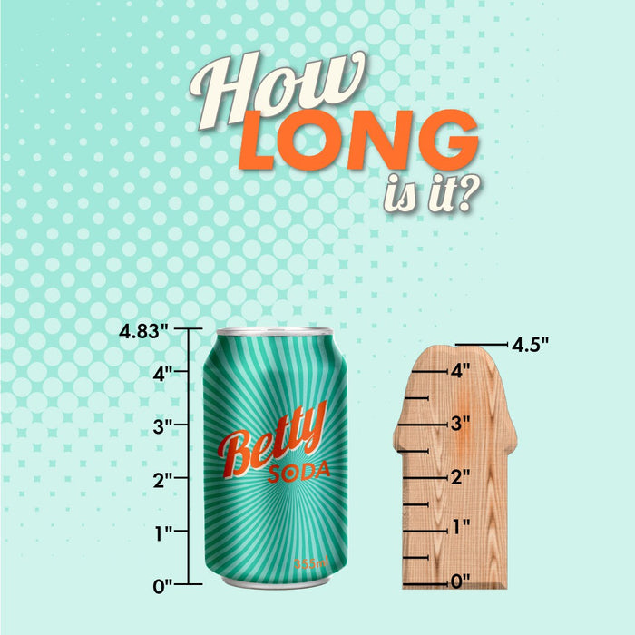 Illustrative image showing a green soda can labeled "Betty Soda" next to a wooden ruler, comparing their heights. The can is marked as 4.83 inches tall, while a section of Naturally Yours 4 Inch Mini Cock - Purple by Blush is depicted.