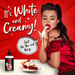 A woman with long dark hair, dressed in red, playfully tastes a white creamy substance from her fingers. The text on the red background reads, "It's White and Creamy!" and "Just like the real thing..." Beside an image of a dessert, there's a bottle of Naughty Jane's Creamy Cum Sex Sauce Lubricant by XR Brands.