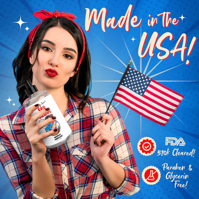 A woman with dark hair, wearing a red headband and plaid shirt, holds an American flag and a large bottle of Naughty Jane's Sex Sauce Natural Water Based Lubricant 16oz by XR Brands. The image has a blue starburst background with text saying "Made in the USA!", "510k Cleared!", "FDA," and "Paraben & Glycerin Free!".