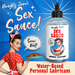 Advertisement for XR Brands' "Naughty Jane's Sex Sauce Natural Water Based Lubricant 8oz." The image features a vintage pin-up style woman in a red polka dot dress, holding a pie and winking. A bottle of the lubricant is prominently displayed with the text "Soooo Wet!" and "Natural Lubricant.