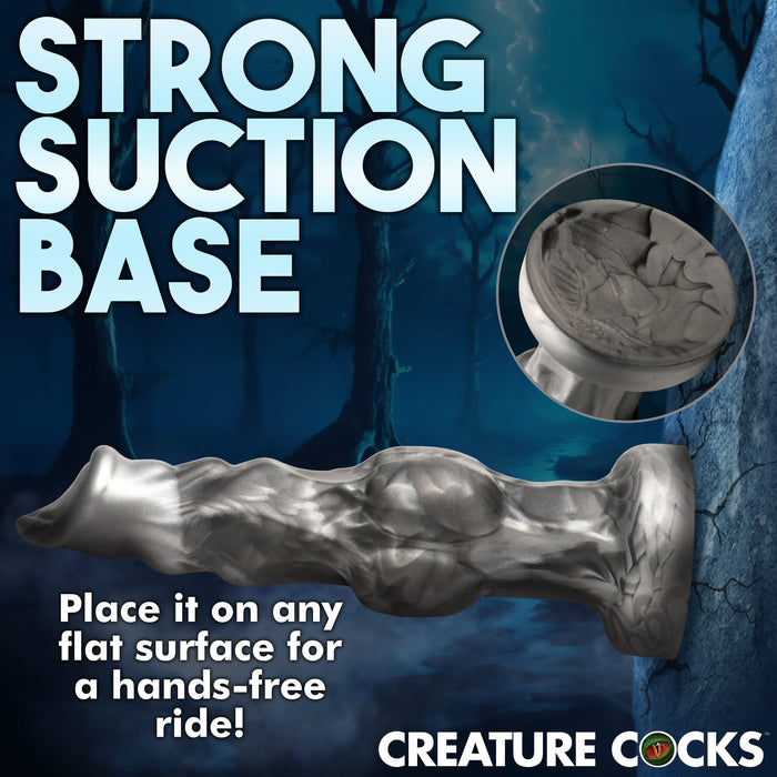 Promotional image for a product named "Night Prowler 6.75 Inch Werewolf Canine Dildo with Knot" by XR Brands, featuring a strong suction cup base for hands-free use. Text on the image highlights the product's premium silicone construction and firm grip on any flat surface. The background shows a dark, eerie forest scene.