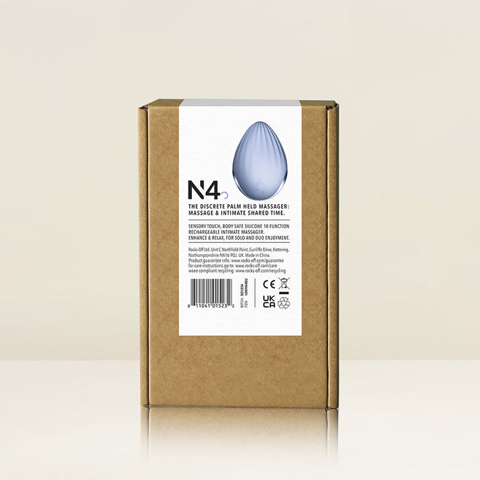 A brown cardboard box stands on a light reflective surface. Attached is a white product description label, which features an image of the Niya N4 Palm Held Powerful Textured Egg Vibrator in blue silicone and related product information text. The background is plain and off-white.