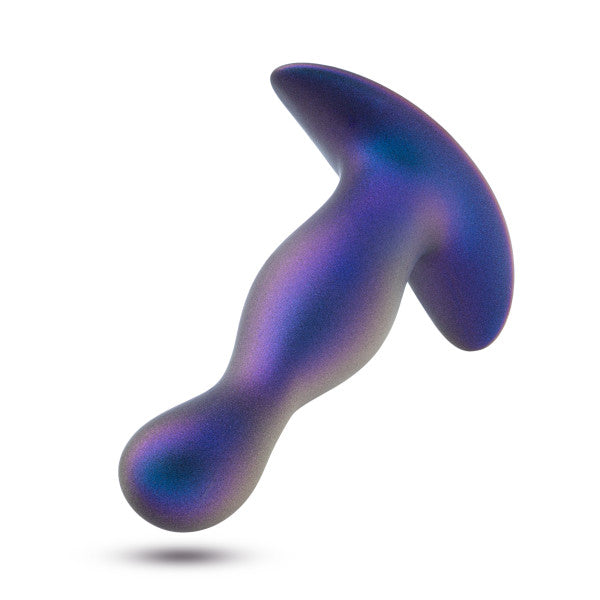 Introducing the Odyssey Vibrating Silicone Prostate Massager & Butt Plug by Blush: This sleek, metallic accessory is expertly crafted for anal exploration. Its bulbous shape and wide base ensure safe and comfortable use, while the smooth, shimmering finish in captivating shades of blue and purple beckons a voyage into pleasure.