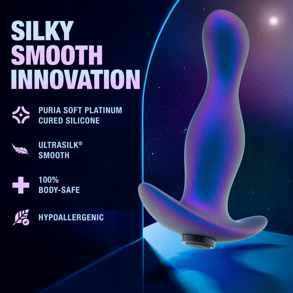 A visual showcases the Odyssey Vibrating Silicone Prostate Massager & Butt Plug by Blush, depicted in purple against a blue surface with a starry backdrop—ideal for your next anal exploration. The text highlights its remarkable features: "Silky Smooth Innovation," "Puria Soft Platinum Cured Silicone," "Ultrasilk® Smooth," "100% Body-Safe," and "Hypoallergenic.