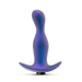 The Odyssey Vibrating Silicone Prostate Massager & Butt Plug by Blush, featuring a smooth silicone finish in a blue and purple gradient with a flared base, stands upright against a plain white background.