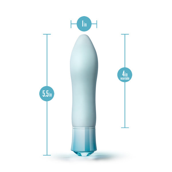 The Oh My Gem Ardor Aquamarine Warming Internal & External Tapered Vibrator by Blush is a light blue personal massager with dimensions of 5.5 inches in total length, 1 inch in diameter, and a 4-inch insertable length. It features a tapered shape and a flared base, and it is USB rechargeable for your convenience.