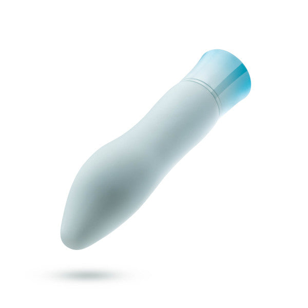 A smooth, white, ergonomic device with a soft blue cap on one end, likely a personal care tool. The Oh My Gem Ardor Aquamarine Warming Internal & External Tapered Vibrator by Blush boasts a sleek, curved design and even features a warming function, making it both versatile and luxurious. Displayed against a plain white background for emphasis.