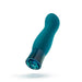 The Oh My Gem Fierce Blue Topaz Warming G-Spot Vibrator by Blush, with its smooth curvy design and cylindrical base that tapers slightly, is floating against a white background. The silicone phthalate-free base features a shiny multifaceted pattern and houses 10 vibrating functions for customizable relaxation.