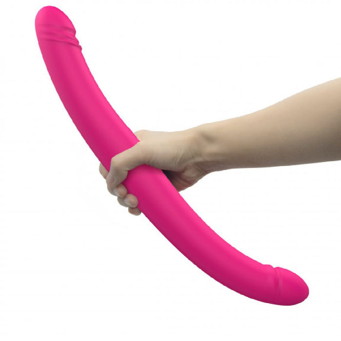 Orgasmic Double Duo 16.5 Inch Vibrating, Thrusting Pink Dildo held in hand