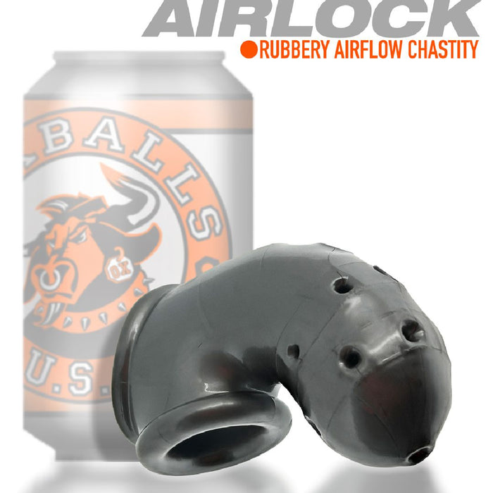 Black rubber device with holes, resembling an airflow male chastity implement, in front of a silver can with an orange logo featuring a bull's head. Text reads "Oxballs Airlock Air-Lite Vented Chastity Cage for Beginners - Steel Grey by Oxballs.