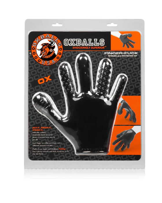 A packaged black novelty glove with shiny, raised textures is presented against an orange and black patterned background. The flexible rubbery glove is labeled "Oxballs Finger Fuck Textured Fingering Glove - Black." The packaging features images of the Oxballs Finger Fuck Textured Fingering Glove - Black in use and the Oxballs logo at the top left corner.