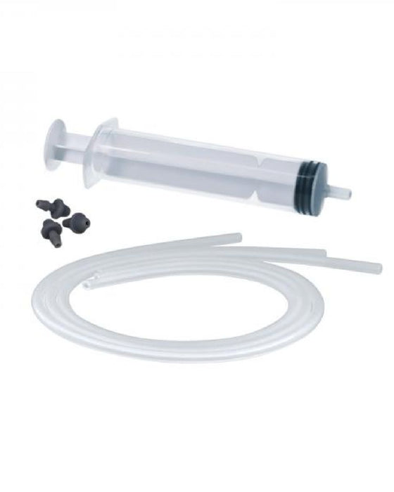 A transparent plastic syringe with a plunger, accompanied by a coiled clear tubing and three small black attachments, is displayed against a white background. This Phthalate-Free kit appears to be a suction device or medical equipment for fluid transfer purposes. The product is the POP Squirting Dildo Refill Accessory Kit by Tantus.